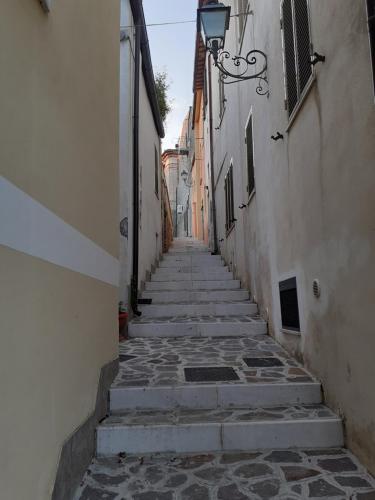 an alley with stone steps leading down to a building at Casa Olga in Pianella