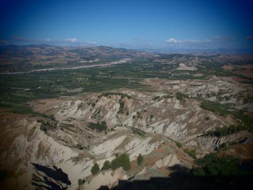 an aerial view of a mountain with trees on it at Soprattutto in Montalbano Jonico