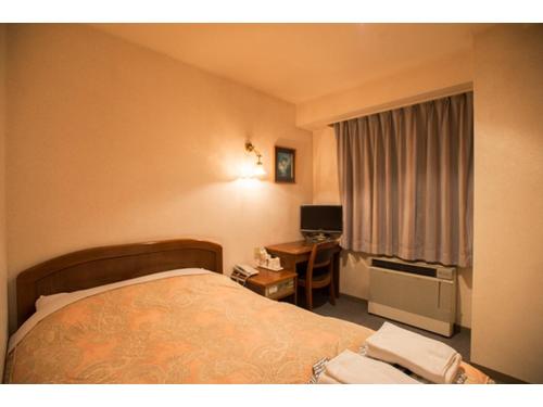 a hotel room with a bed and a desk at Famy Inn Makuhari - Vacation STAY 16039v in Chiba