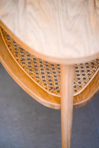 a wooden table with a seat on a wooden stool at Eumorphia Studios & Apartments in Skiathos Town