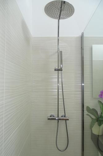 a shower with a shower head in a bathroom at Sailor's House Porto Cervo in Porto Cervo