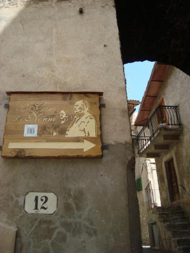 a painting of a man on the side of a building at La Casa dei Nonni B&B in Scanno