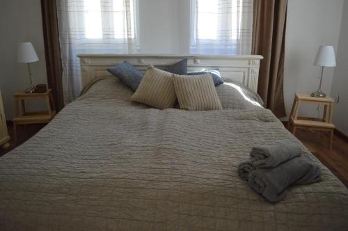 מיטה או מיטות בחדר ב-Kiskilenc Vendégház