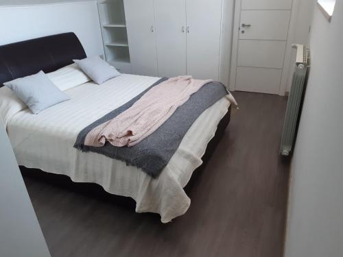 Postel nebo postele na pokoji v ubytování Il Rifugio di Farinella