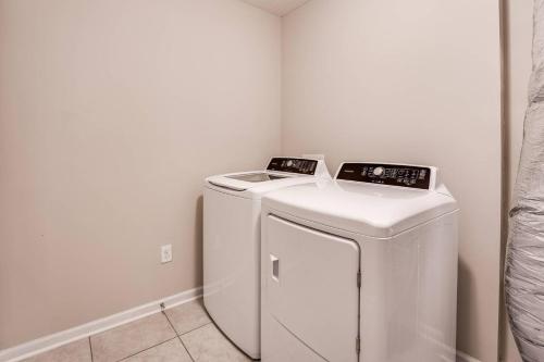 a white washer and dryer in a room at Moody Oaks in Orange Park
