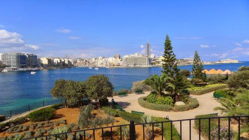a view of a body of water with a city at Sliema Creek Suites in Sliema