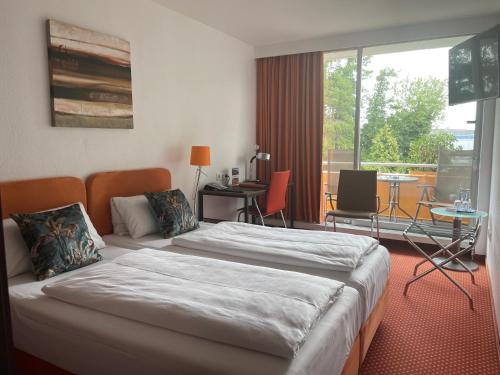 Postel nebo postele na pokoji v ubytování Hotel Unterfeldhaus