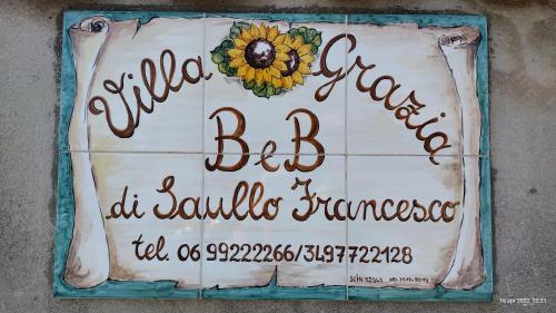 a cake with a sunflower on top of it at Villa Grazia in Ladispoli