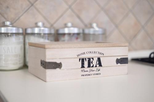 a wooden tea box sitting on top of a counter at Roma Marine House in Lido di Ostia