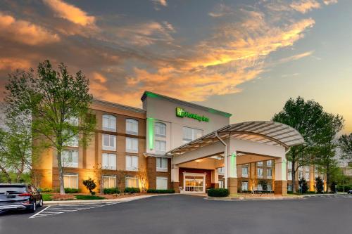 a rendering of a hotel building with a parking lot at Holiday Inn Franklin - Cool Springs by IHG in Franklin