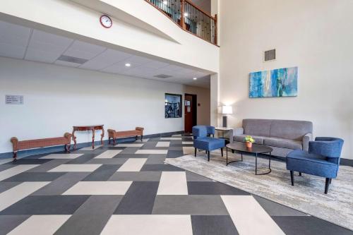 a waiting room at a hospital with couches and chairs at Best Western Plus McKinney Inn and Suites in McKinney