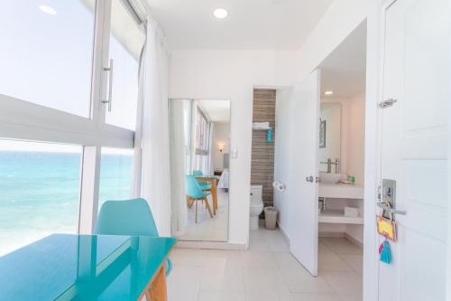 a bathroom with a view of the ocean at Mia Reef Isla Mujeres - All Inclusive Resort in Isla Mujeres