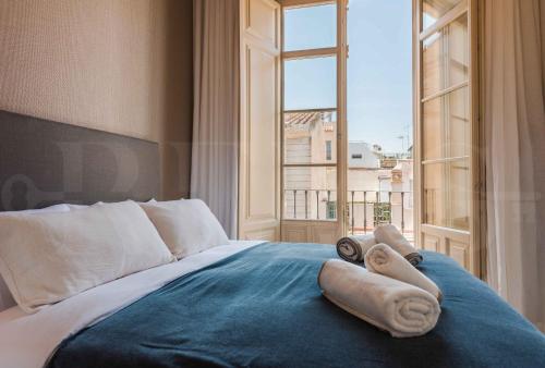 En eller flere senge i et værelse på Premium loft in the heart of Malaga by REMS