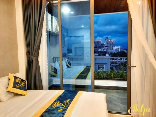 Postel nebo postele na pokoji v ubytování Aloha Hotel Vung Tau