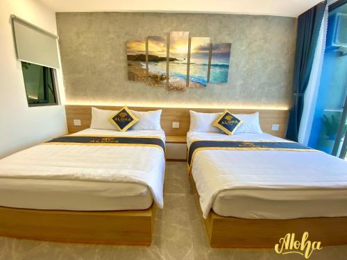 Postel nebo postele na pokoji v ubytování Aloha Hotel Vung Tau