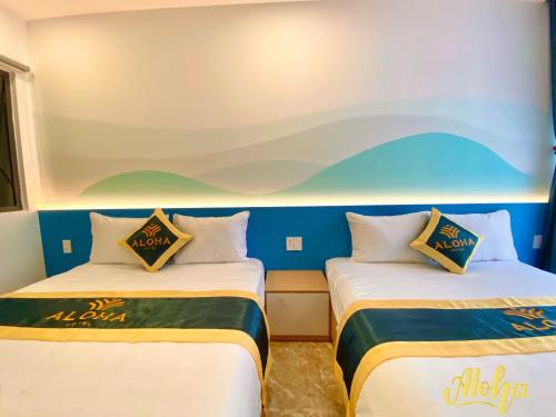 Postel nebo postele na pokoji v ubytování Aloha Hotel Vung Tau