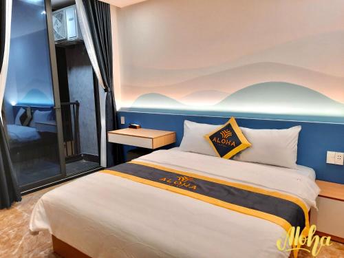 Postel nebo postele na pokoji v ubytování Aloha Hotel Vung Tau