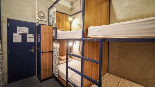 Ένα ή περισσότερα κρεβάτια σε δωμάτιο στο Hoft Hostel Bangkok