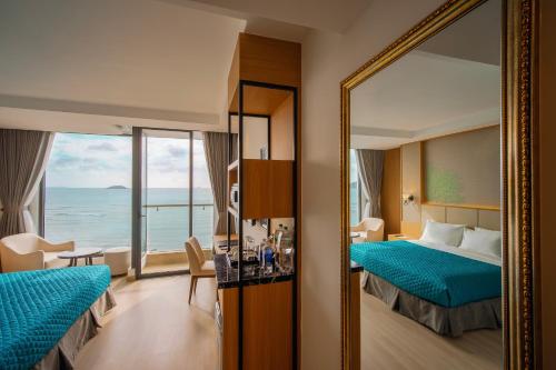 Postel nebo postele na pokoji v ubytování Navada Beach Hotel