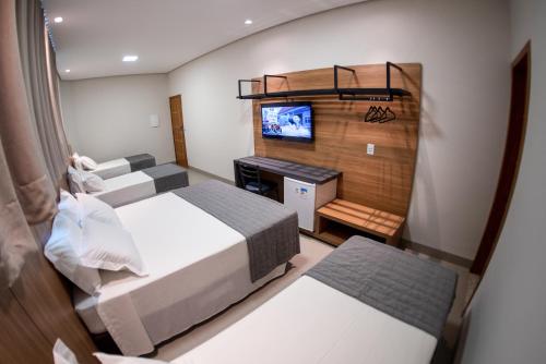 Ένα ή περισσότερα κρεβάτια σε δωμάτιο στο Hotel Du Valle - Salinas - MG