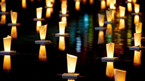 a row of candles sitting in the water at Toyoko Inn Hakata Ekimae Gion in Fukuoka