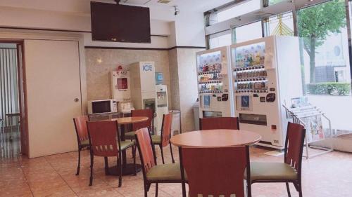 a restaurant with tables and chairs in a room at Toyoko Inn Hakata-eki Minami in Fukuoka