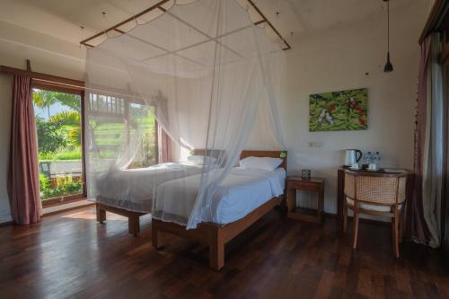 Uma cama ou camas num quarto em Lesong Hotel and Restaurant