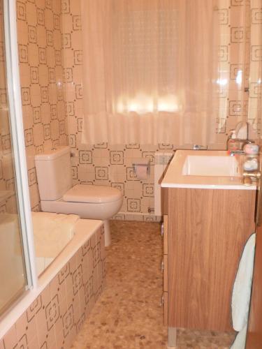 a bathroom with a sink and a toilet and a shower at Casa Los Olivos in Grávalos