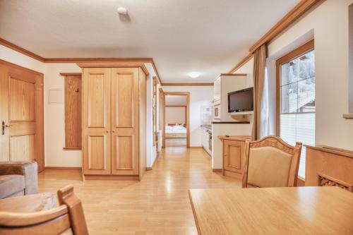 a kitchen and dining room with a table and chairs at Landhaus Anja in Neustift im Stubaital