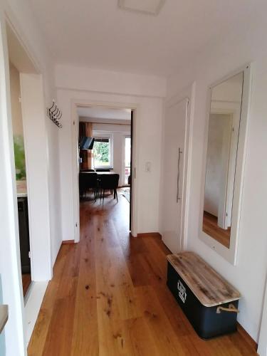an empty living room with a table and a box at Ferienhaus Peggy in Kurort Oybin