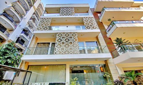 an apartment building with balconies on the side of it at Treebo Trend Sai Village Gold Souk - Sec 43 in Gurgaon