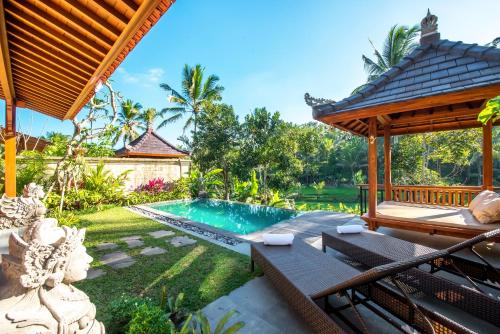 an image of a villa with a swimming pool at GK Bali Resort in Tegalalang