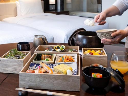 a table with two boxes of food on a table at Okinawa EXES Naha in Naha