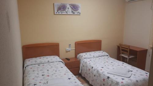 Katil atau katil-katil dalam bilik di Hostal Los Amigos