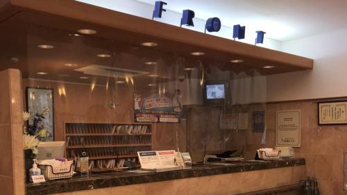 a fast food restaurant with a sign above a counter at Toyoko Inn Kanazawa Kenrokuen Korimbo in Kanazawa