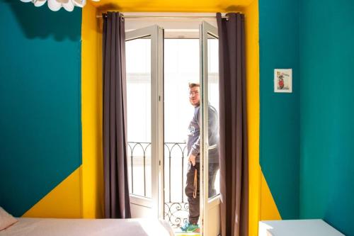 
a man standing in front of a window at Sungate ONE in Madrid
