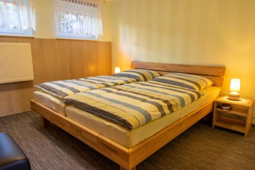a bedroom with a large bed in a room at Ferienwohnung im Souterrain in Freest