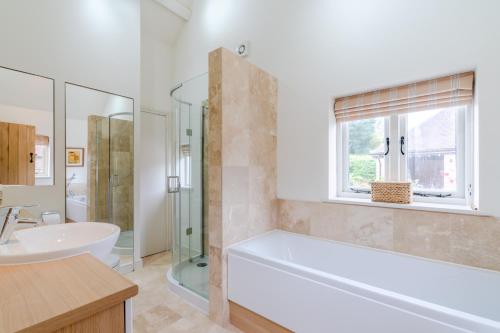 A bathroom at The Barn at Kington Grange