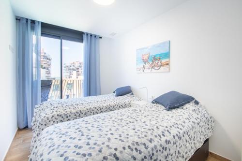 A bed or beds in a room at SEA VIEW 2 BDR Apartment Allonbay Village & SPA
