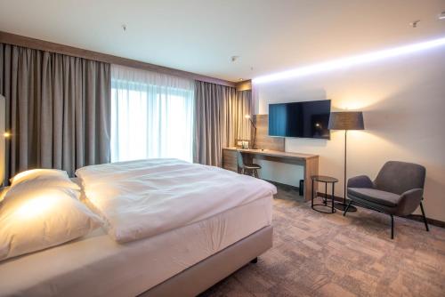 Ένα ή περισσότερα κρεβάτια σε δωμάτιο στο Park Inn By Radisson Wismar