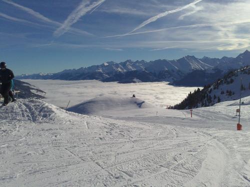 a person is skiing down a snow covered ski slope at Untersteinhof in Mittersill