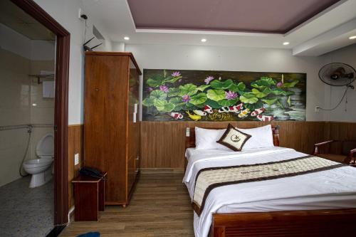 Säng eller sängar i ett rum på Cong Thuong Hotel