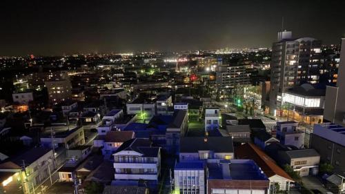 a view of a city at night with at Toyoko Inn Meitetsu Chiryu Ekimae in Chiryu