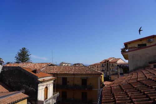 a view of roofs of buildings in a city at 4ROOMS b&b - HOLIDAY HOME in Lamezia Terme