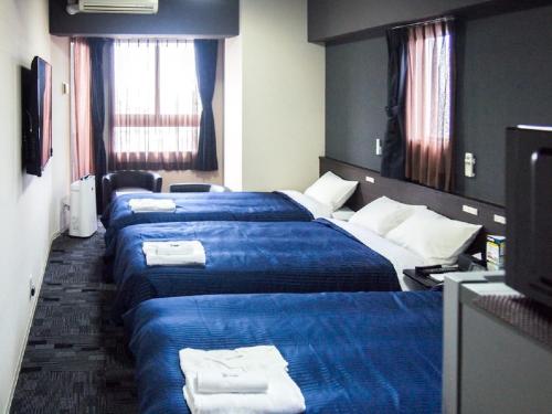 Katil atau katil-katil dalam bilik di HOTEL LiVEMAX BUDGET Nagoya Taikodori