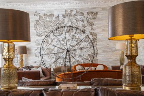 a living room with couches and a ferris wheel mural at Lincombe Hall Hotel & Spa - Just for Adults in Torquay