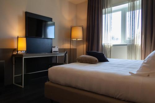 Postel nebo postele na pokoji v ubytování G Hotel Ancona