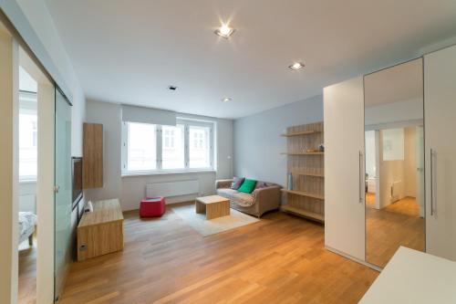 a living room with a couch and a table at Hastal Gallery in Prague