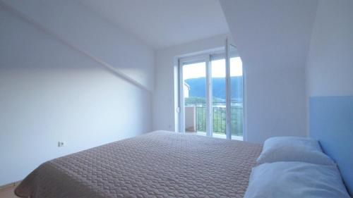 Katil atau katil-katil dalam bilik di Divine Apartments Budva