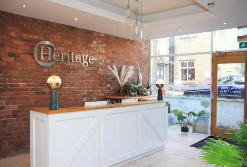 a bar in a store with a brick wall at Heritage Serviced Suites - Serviced Apartments in Huddersfield